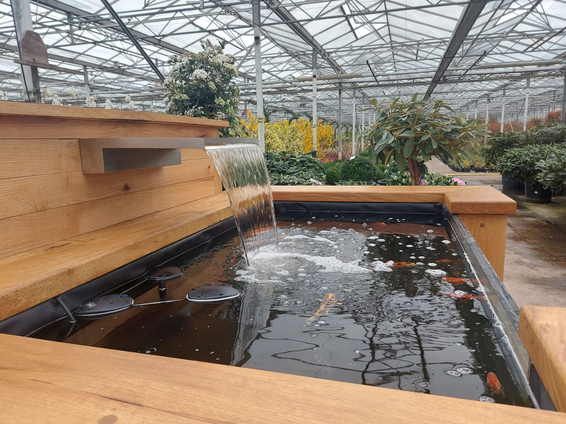 Handcrafted timber sleeper pond with waterfall by Wood & Water
