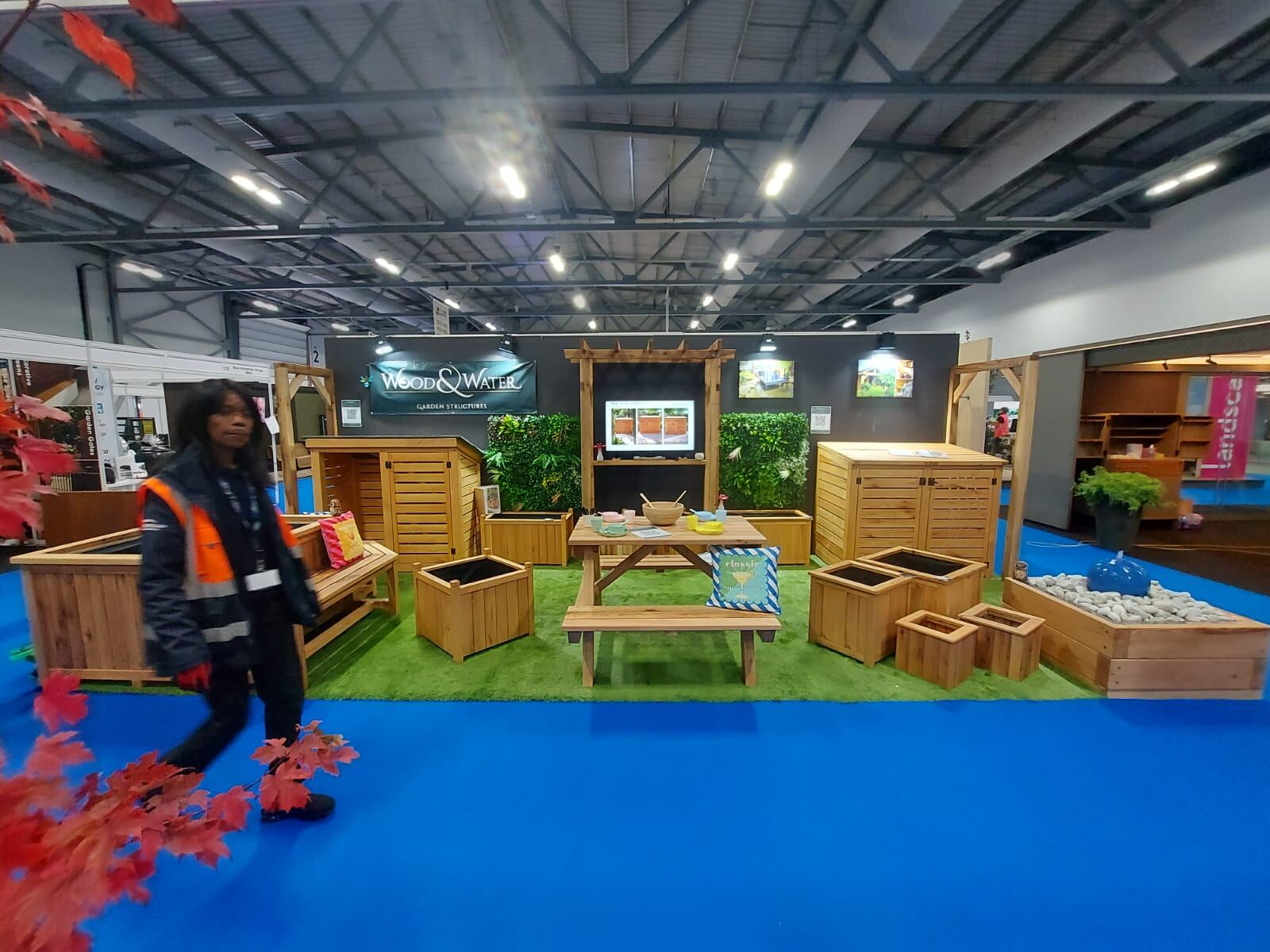 Wood & Water show stand displaying trade oak planters, timber sleeper ponds, benches and storage